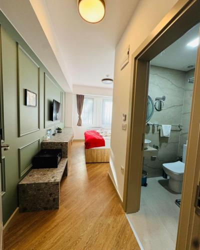 a large bathroom with a toilet and a sink at Old Stone Hotel Skopje in Skopje