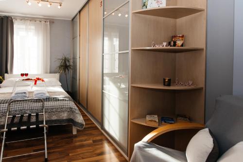 En eller flere senge i et værelse på Maya's Flats & Resorts - Old Town Piwna