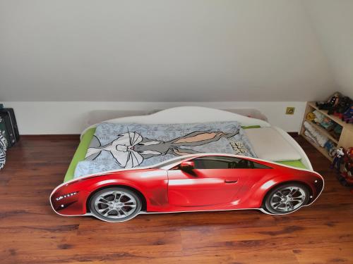 Giường trong phòng chung tại Dwupoziomowy apartament zielone spokojne rodzinne