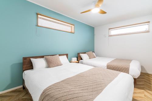 En eller flere senge i et værelse på Grandioso Okinawa Pool Villa 8 - Vacation STAY 52643v