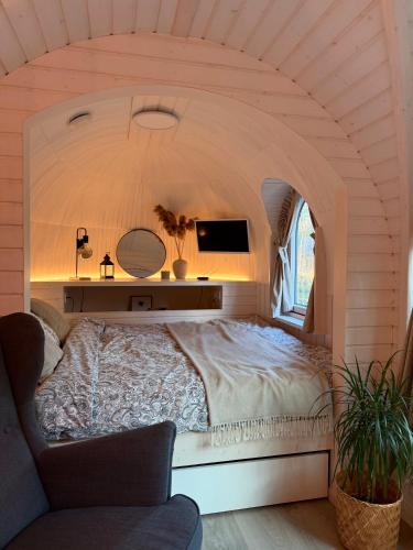 a bedroom with a large bed in a room at Pedaspä Igloo House and Sauna in Pedaspea