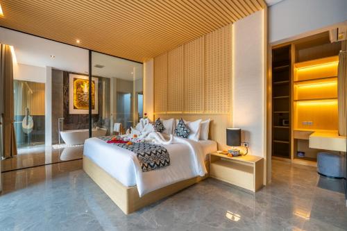 Ένα ή περισσότερα κρεβάτια σε δωμάτιο στο Villa Narda Seminyak by Nagisa Bali