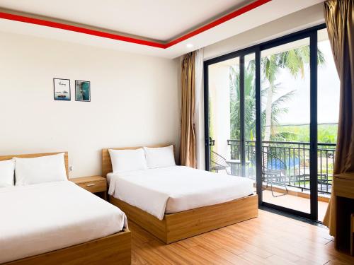 Postel nebo postele na pokoji v ubytování Hometown An Viên Prime Villa Hoi An