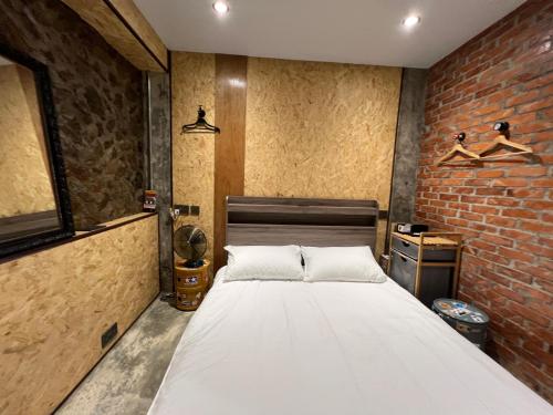 Postel nebo postele na pokoji v ubytování 九份玩具屋