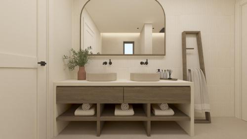 a bathroom with a sink and a mirror at The Yard Corfu Boutique Hotel and Spa in Moraitika