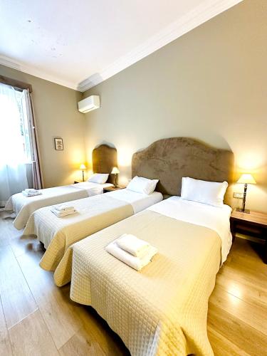 Ένα ή περισσότερα κρεβάτια σε δωμάτιο στο Hotel Hermes T