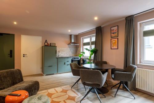 Kuchyň nebo kuchyňský kout v ubytování Petit Riche Apartments