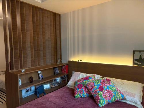 a bedroom with a bed and a large window at Estúdio dos sonhos in Rio de Janeiro