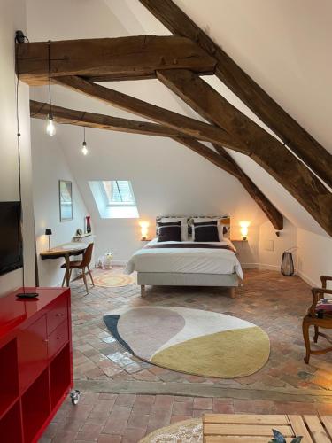 Ένα ή περισσότερα κρεβάτια σε δωμάτιο στο Le Petit Monde de Molly