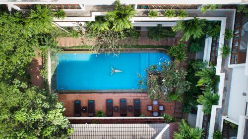 an overhead view of a swimming pool in a building at Indra Angkor Residence in Siem Reap