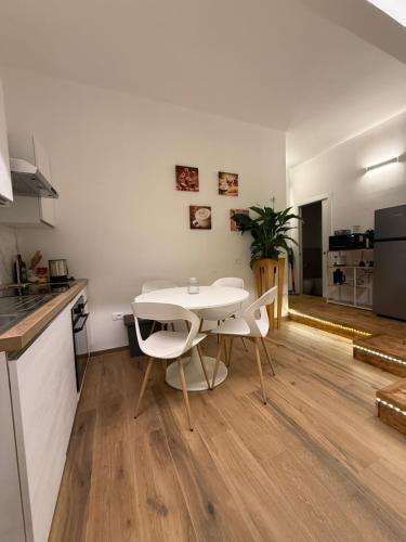 a kitchen and dining room with a table and chairs at Ama Esclusive Spa Florence in Florence