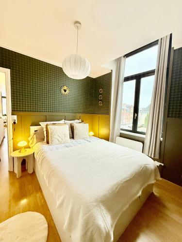 Postel nebo postele na pokoji v ubytování L'Echappée Belle au coeur d'Arras