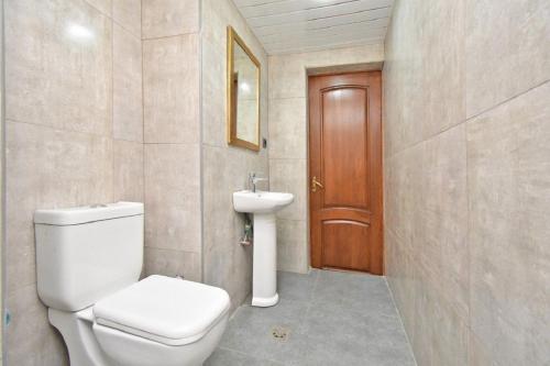 a bathroom with a toilet and a sink at tumanyan 38 guest hause in Yerevan