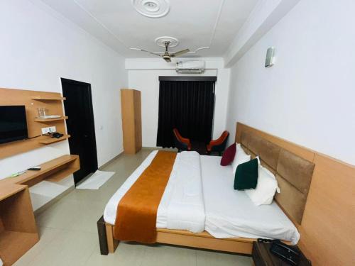 Voodi või voodid majutusasutuse Deluxeinn toas