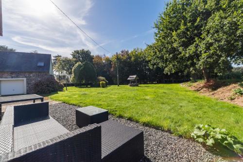 Κήπος έξω από το Maison chaleureuse parfaite pour les familles