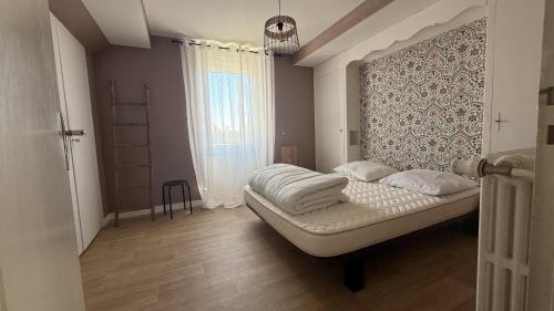 Postel nebo postele na pokoji v ubytování La Villa Montalat - Jolie et Calme