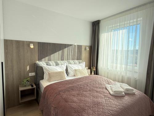 Postel nebo postele na pokoji v ubytování Cozy LOFT Suites & Urban Retreats