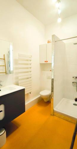 a bathroom with a toilet and a sink and a shower at Maison 6 personnes Angouleme in Angoulême