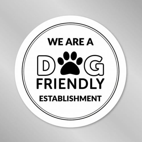 a sticker with the words we are a dog friendly establishment at Southside Street Apartments in Plymouth