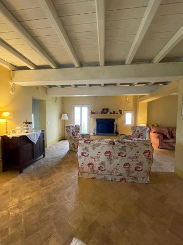 a living room with two chairs and a couch at Casale IL SAMBUCO sui colli bolognesi in San Lazzaro di Savena