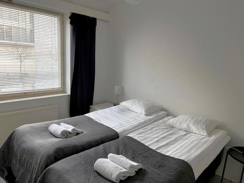 Postel nebo postele na pokoji v ubytování Kotimaailma Apartments - 1BR in city center of Turku