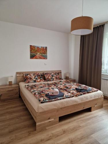 a bedroom with a large bed in a room at Apartma Kreda in Mojstrana