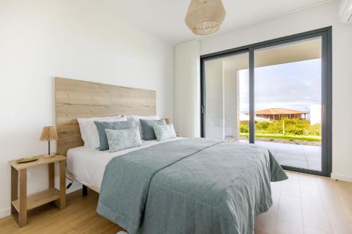 En eller flere senge i et værelse på Vale Atlantico - BY SCH - E