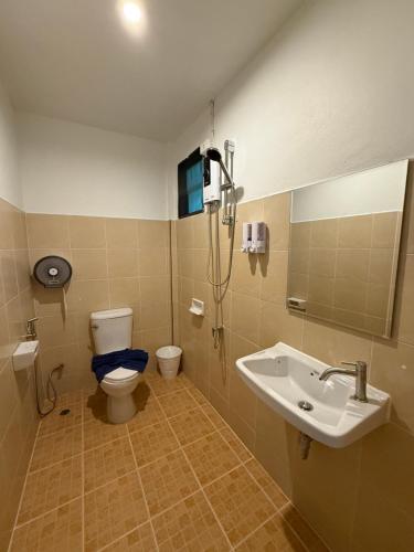 a bathroom with a toilet and a sink at SeaSmile Beach Resort Koh Jum Formerly Sunsmile in Ko Jum