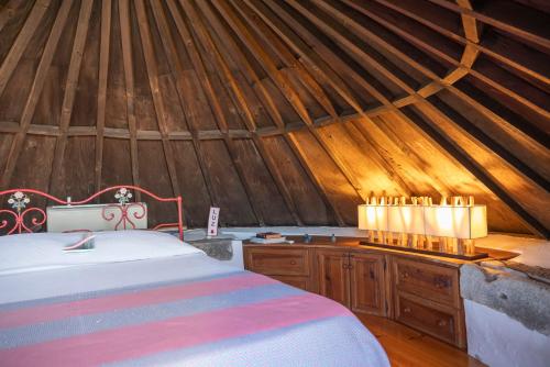 a bedroom with a bed in a yurt at Moinho da Senta in Rio Maior