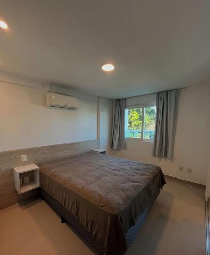 En eller flere senge i et værelse på Ponta Negra Flat - Melon Flat