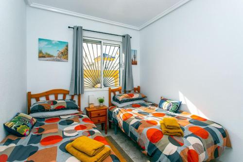 Ένα ή περισσότερα κρεβάτια σε δωμάτιο στο CH Marquesa Golf (Ciudad Quesada)