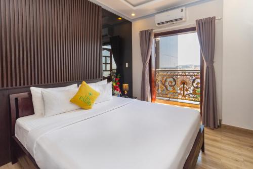 Ένα ή περισσότερα κρεβάτια σε δωμάτιο στο The Palms Hotel