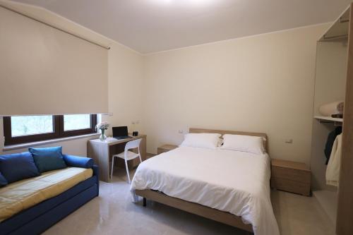 Кровать или кровати в номере Albergo Peluso