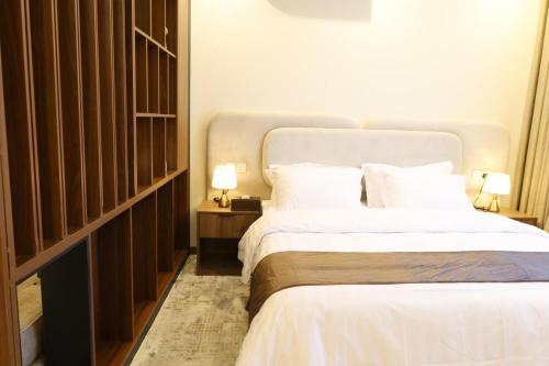 Кровать или кровати в номере شقق مفروشة هداج تاون العلا