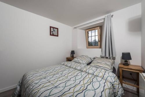 En eller flere senge i et værelse på Maison de village 4 à 6 personnes