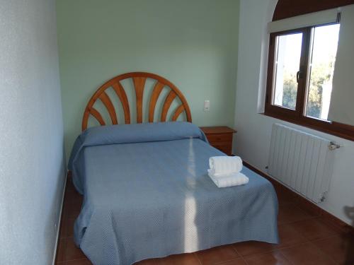 Postel nebo postele na pokoji v ubytování PENSION SAN CRISTOBAL cerca de Cuenca