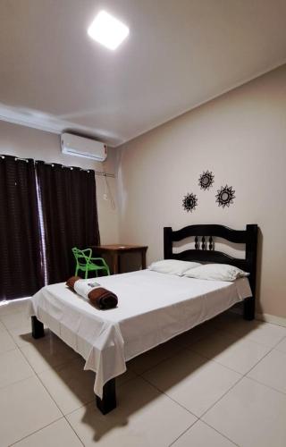 a bedroom with a large bed in a room at Becker Center Hotel in Querencia