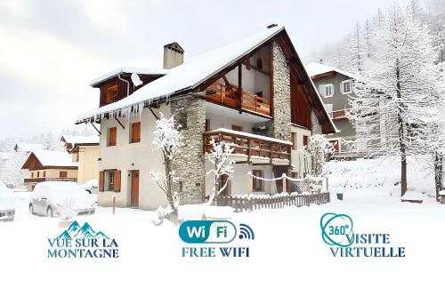 Un edificio cubierto de nieve con el logotipo de Wski Winter Village. en Casa-Le Toussiard apart dans chalet St-Véran 4-6p, en La Chalp-Sainte-Agathe