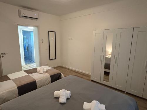 En eller flere senge i et værelse på New House - Garden park bbq