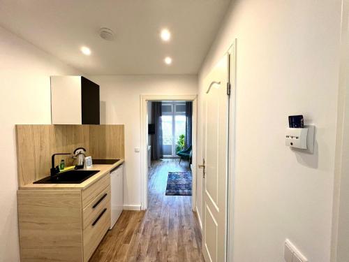 a kitchen with a sink and a counter at Kapitaenshaus-Lassen-Zimmer-Sindbad in Westerland (Sylt)