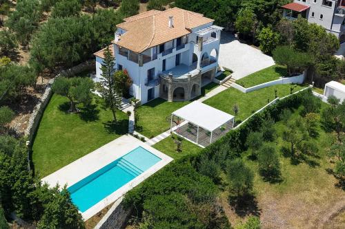 an aerial view of a house with a swimming pool at Fask Villa Zakynthos, Infinity Views & Serenity by Villa Mana Gers in Akrotiri