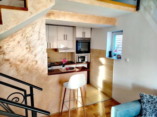 Η κουζίνα ή μικρή κουζίνα στο Apartman Sunset Lux