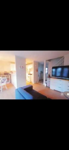 a large living room with a couch and a kitchen at greenview mck sunny room in Calgary