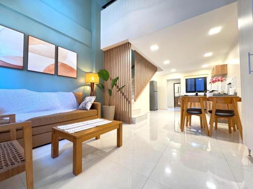 a living room with a couch and a table at Iguazu Lofts in Puerto Iguazú
