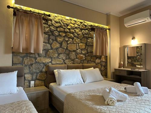 Ένα ή περισσότερα κρεβάτια σε δωμάτιο στο Alkionis Pool View Apartments