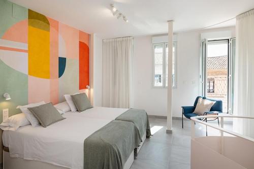Postel nebo postele na pokoji v ubytování ChezmoiHomes PATIO de SOMBRA Urban Suites