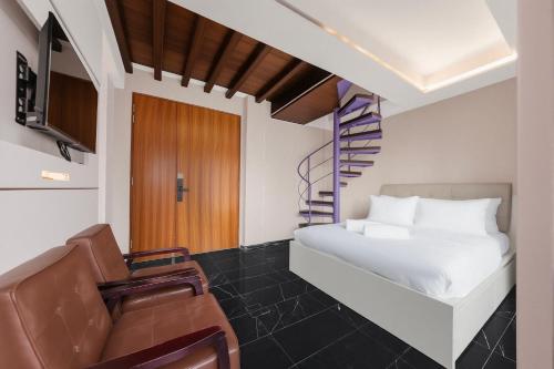 En eller flere senge i et værelse på D'NOVA HOTEL Bugis-newly renovated