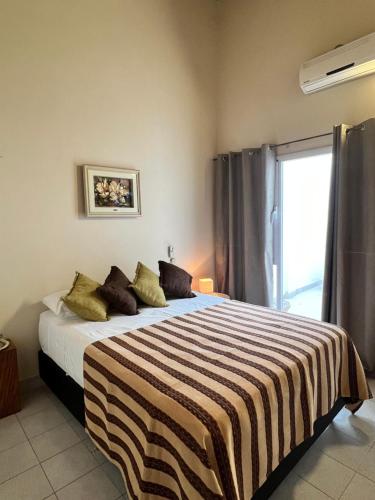 En eller flere senge i et værelse på Departamento ruta 22 Plottier