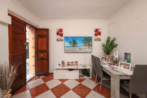a room with a desk and a table with chairs at Tropical Elegance in central Panglao ! in Panglao