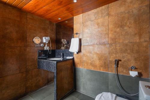 a bathroom with a sink and a shower at Sumitel Vista 800m from Mall Road in Darjeeling